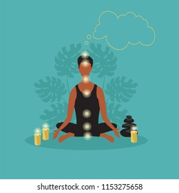 a person meditates sitting in a Lotus position. human chakras