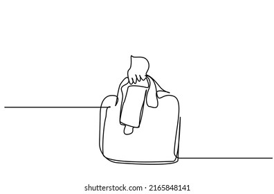 person on vacation on travel holding hat and mask