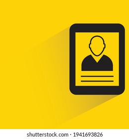 person profile in tablet with shadow on yellow background