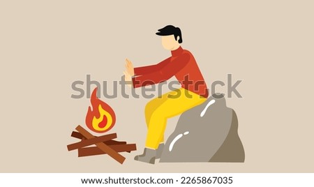 Person put on fire his hands for having heat from fire to warm up his body and warm surroundings. Man and sitting by bonfire putting logs and getting warmth. Camping and traveling, tourist man bonfire