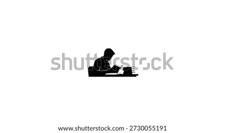 a person reading a book at a desk focused and engrossed silhouette