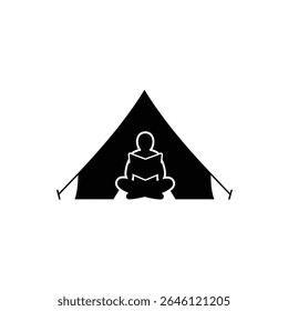 Person reading book inside camping tent silhouette.