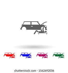 The person repairs under the car multi color icon. Simple glyph, flat vector of car repear icons for ui and ux, website or mobile application