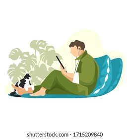 una persona está sentada en la cama y leyendo un libro en una tableta. un hombre en casa con un gato. vectorial
