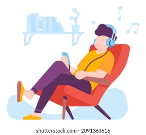 Person sitting in chair and listening relaxing music in headphones