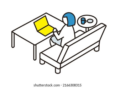 Eine Person, die auf einem Sofa sitzt und einen Laptop auf einem Tisch bedient