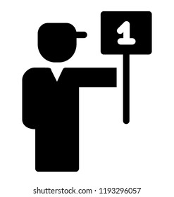 A person standing with the board in hand with number 1 written depicting rugby umpire 