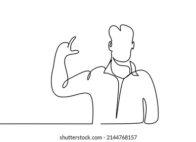 a person is standing and making a size sign with his hand and fingers