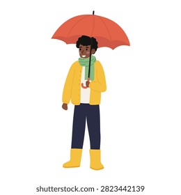Person stands under a red umbrella while wearing a yellow raincoat and yellow boots in a rainy setting
