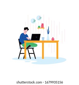 A person staying home working on a laptop in the kitchen