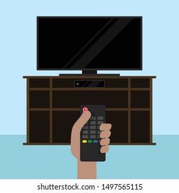 
person with tv off on dresser with tv control in hand