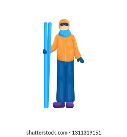 Person of unfamiliar gender, wearing ski suit, stands with skis in right hand