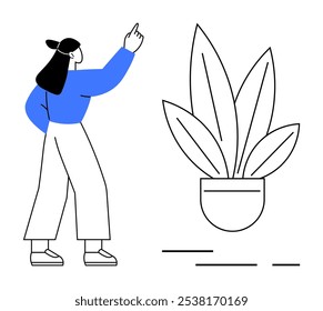 A person wearing a blue shirt and light pants stands pointing upwards beside a large potted plant with long leaves. Ideal for growth idea, nature projects, environmental campaigns, education