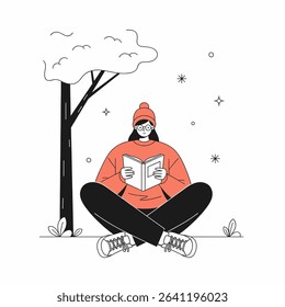 A person wearing glasses and a beanie sits cross-legged, reading a book under a tree with stars.