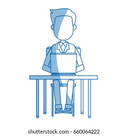 person working on computer sitting on a chair behind the office desk