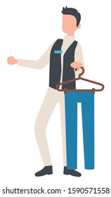 Person working in shop as consultant vector, isolated character giving consultation and advice. Man with trousers pants hanging on hanger flat style