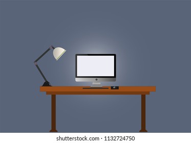 Personal computer is on the table
have a light with white screen and isolate background