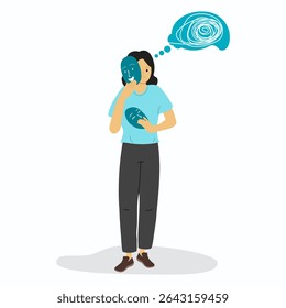 Personality disorder concept. A young woman holding happy mask to covering her real face which was crying and thinking a lot. 