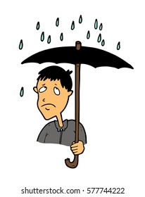 The pessimistic upset man  tired of the constant heavy rains and cold weather and displeased looking at raindrops, hiding under a big umbrella during the walk. 