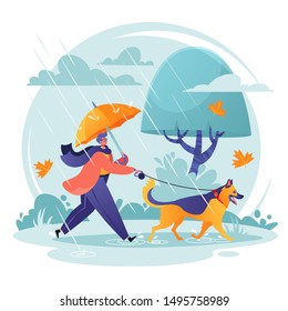 Pet care concept. Man walking his dog in spite of adverse weather conditions. Autumn landscape in rainy day, leaves fall, wind blows. Dog breed German shepherd is happy. His master loves him.