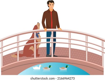 Pet owner walking with cute dog. Caring for animals, joint pastime with pets concept. Guy with puppy, domestic animal companion standing on bridge. Male character spends time with dog outdoor