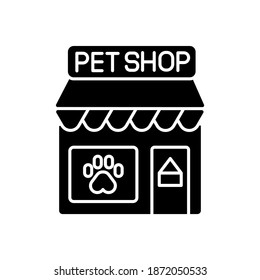 Pet shop black glyph icon. Local store with various products for animals silhouette symbol on white space. Small business, petshop. Storefront with paw print on window vector isolated illustration