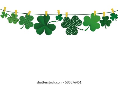 Petals of clover with a picture hanging on a rope with clothespins. St.Patrick 's Day. Vector illustration. Greeting card with empty space for text or advertising. On a white background