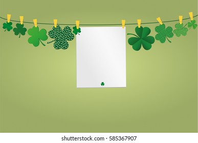 Petals of clover with a picture hanging with paper blank on a rope with clothespins. St.Patrick 's Day. Vector illustration. Greeting card with empty space for text or advertising. On a green back