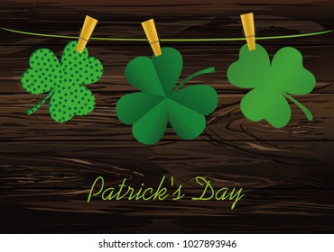 Petals of decorative clover four-leaf hanging on a rope with clothespins. St.Patrick 's Day. Vector illustration. Greeting card with empty space for text or advertising. On a wooden background.