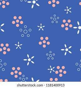 Petite flowers seamless pattern. Bright blue with dusty pink flowers. Abstract vector motif with reference to small flowers in a field. Perfect for printing on textile, wallpaper and stationary.