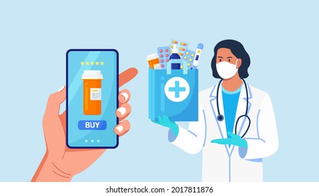 Pharmacist in disposable gloves with paper bag with medicines, drugs and pill bottles inside. Online Home delivery pharmacy service on phone screen. Doctor in white coat, facial mask with stethoscope