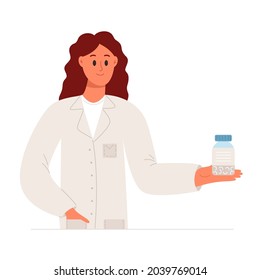 Pharmacist is holding a pack of pills