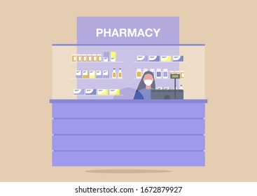 Pharmacy counter, young female pharmacist wearing a protective mask, coronavirus outbreak