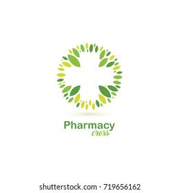 Pharmacy cross green leaves vector logo.  Organic medical clinic symbol. Healthcare abstract tree. 