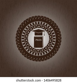 Phd thesis icon inside badge with wood background