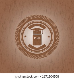 Phd thesis icon inside badge with wooden background