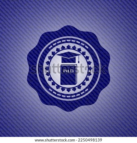 Phd thesis icon inside emblem with denim high quality background. 