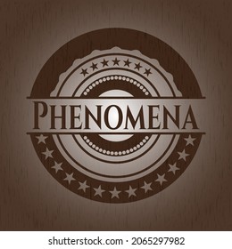 Phenomena-Abzeichen mit Holzhintergrund. 