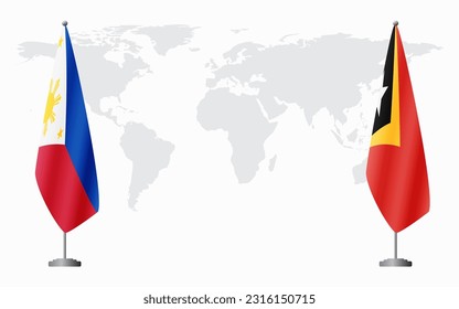 Philippines and East Timor flags for official meeting against background of world map.