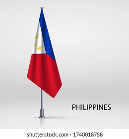 Filipinas colgando la bandera en el asta