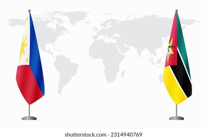 Philippines and Mozambique flags for official meeting against background of world map.