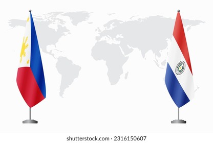 Philippines and Paraguay flags for official meeting against background of world map.