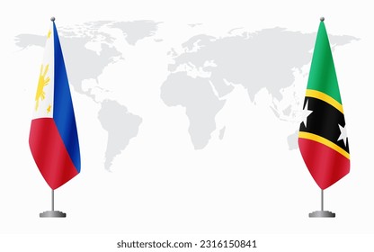 Philippines and Saint Kitts and Nevis flags for official meeting against background of world map.