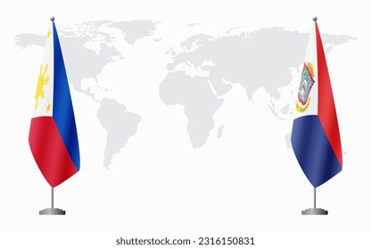 Philippines and Sint Maarten flags for official meeting against background of world map.