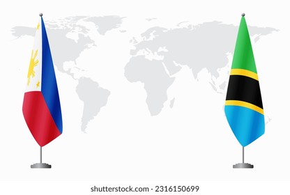 Philippines and Tanzania flags for official meeting against background of world map.