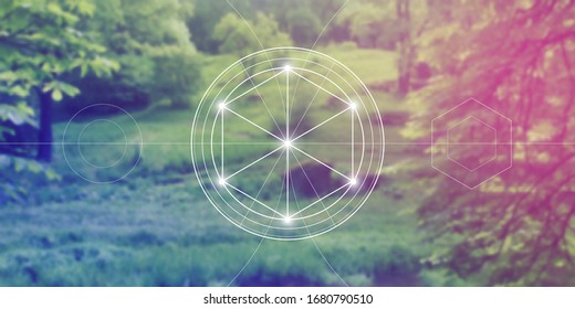 Philosopher stone sacred geometry spiritual new age futuristic illustration with transmutation interlocking circles, triangles and glowing particles in front of blurred natural background.