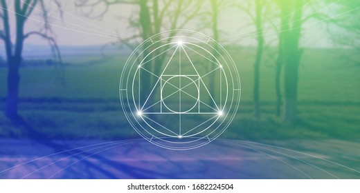 Philosopher stone sacred geometry spiritual new age futuristic illustration with transmutation interlocking circles, triangles and glowing particles in front of blurred natural background.