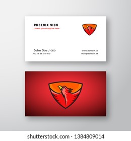 Phoenix Abstract Vector Logo and Business Card Template. Flying Fire Bird Illustration in a Shield on Red Background. Premium Stationary Realistic Mock Up. Isolated.