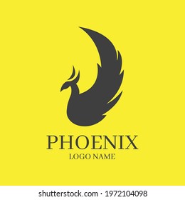 Phoenix bird stylized silhouette icon on yellow background. Logo template in the shape of a flying phoenix. The concepts of growth, strength and freedom.