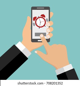 phone with an alarm clock in hand